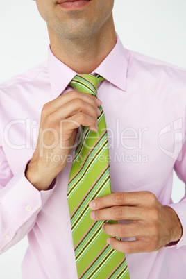 Buisnessman straightening tie