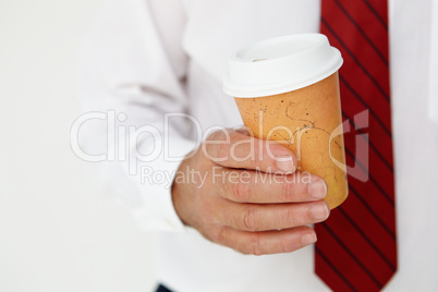 Businessman holding takeout coffee