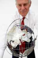 Senior businessman with globe