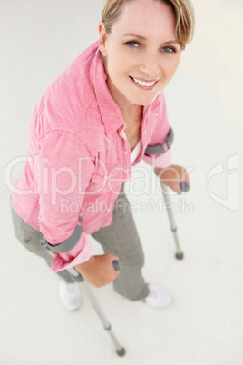 Woman walking with crutches