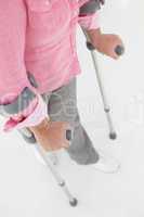 Woman walking with crutches