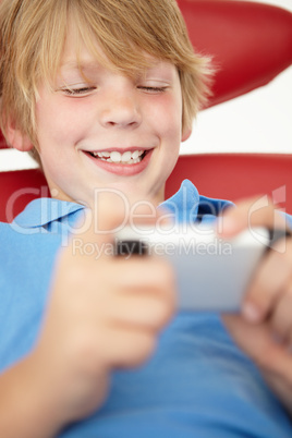 Young boy using cellphone