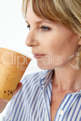Businesswoman drinking takeout coffee