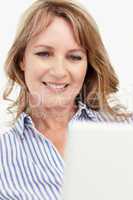 Mid age businesswoman using laptop