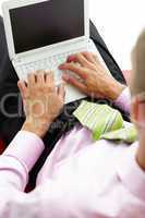 Young businessman using laptop