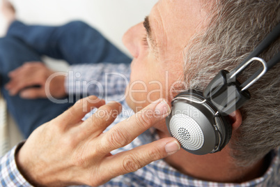 Mid age man wearing headphones