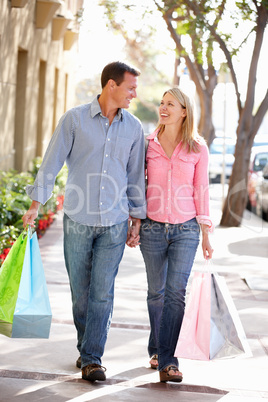 Couple carrying shopping