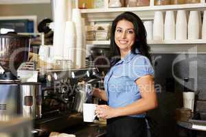 Woman working in coffee shop