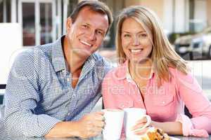 Couple sitting at sidewalk café