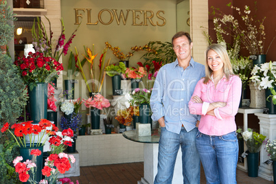 Couple standing outside florist