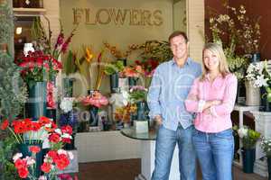 Couple standing outside florist