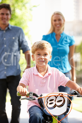 Parents with boy on bike