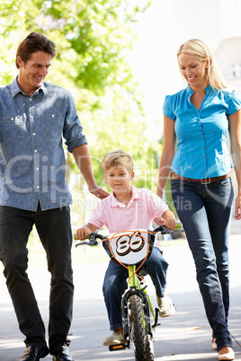 Parents with boy on bike