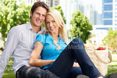 Couple in city park with picnic