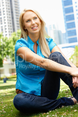 Woman sitting in city park