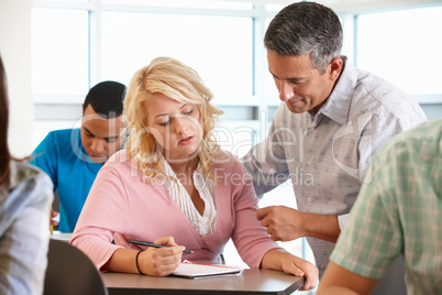 Tutor helping student in class