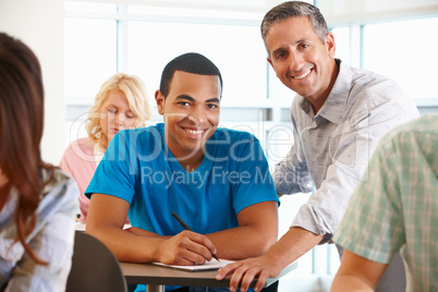 Tutor helping student in class