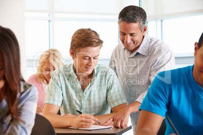 Tutor helping student in class