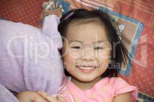 Asian girl with her soft toy