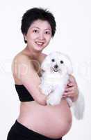 Pregnant Woman Holding a Dog