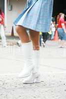 girl using a beautiful boots on a parade