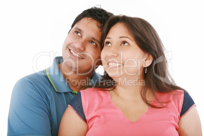 Closeup portrait of a happy couple looking at something interest