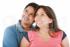 Closeup portrait of a happy couple looking at something interest