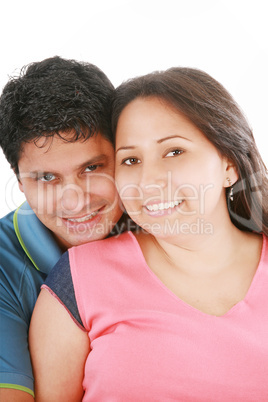 Portrait of handsome man hugging his wife from behind against wh