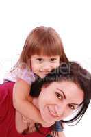Mother and daughter smiling into the camera lens