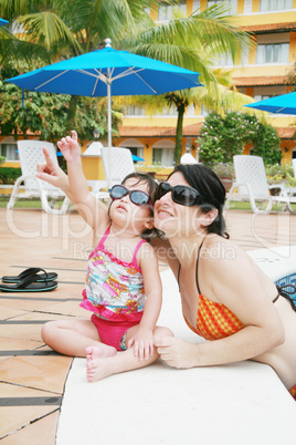 Mother and Daughter Playing in the Pool