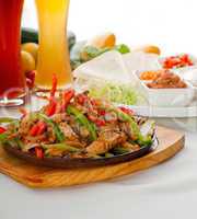 original fajita sizzling hot  on iron plate