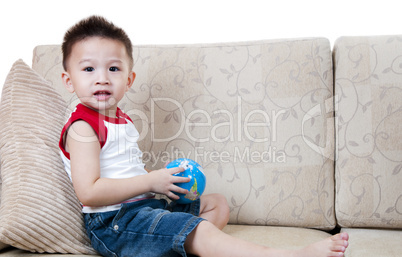 Asian boy with toy.