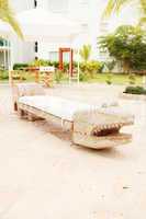 Home exterior patio with handcraft wooden sofa with an aligator
