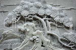 Chinese Feng Shui pine tree carving.