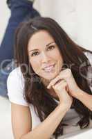 Happy Smiling Beautiful Woman Laying on Sofa