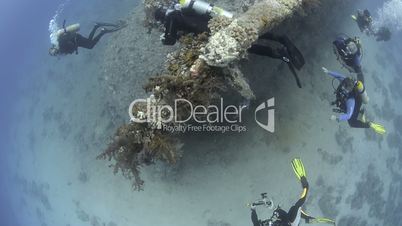 scuba divers exploring the shipwreck