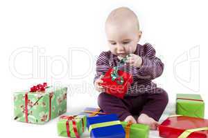 young child unpacking presents
