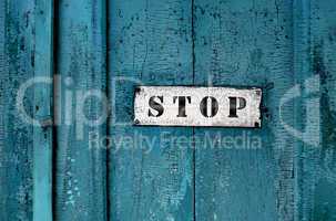 a sign saying ''stop''on the grunge wooden background