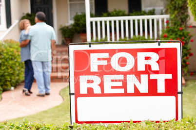 Senior Hispanic couple renting new home