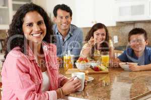 Hispanic family eating breakfast