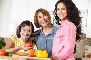 Mother,daughter and grandmother cooking