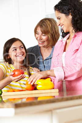 Mother,daughter and grandmother cooking