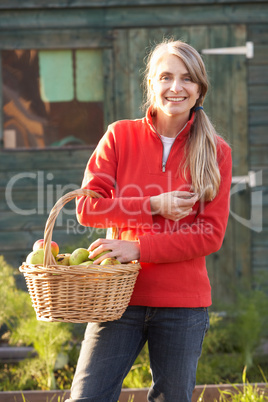 Woman with home-grown fruit