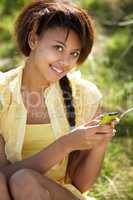 Teenage girl using phone outdoors