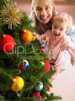 Mother and daughter with Christmas tree