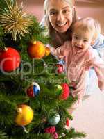 Mother and daughter with Christmas tree