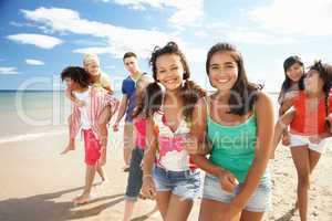 Teenagers walking on beach