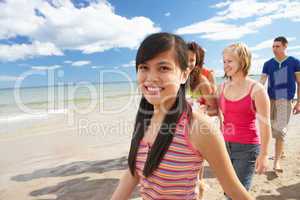 Teenagers walking on beach