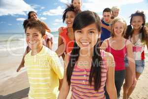 Teenagers walking on beach