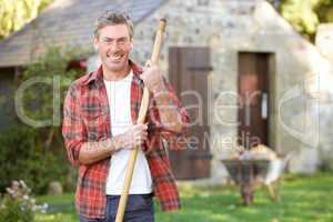 Man working in country garden